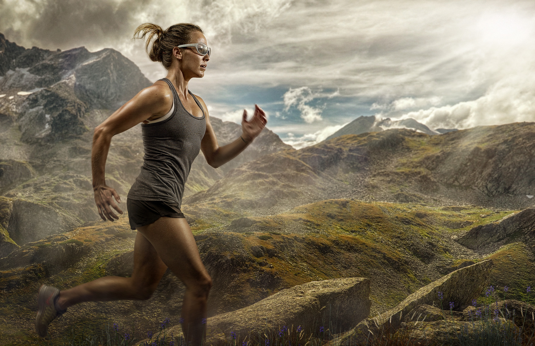 female athlete runner in mountains wearing protective sunglasses photography by Vancouver advertising photographer Waldy Martens
