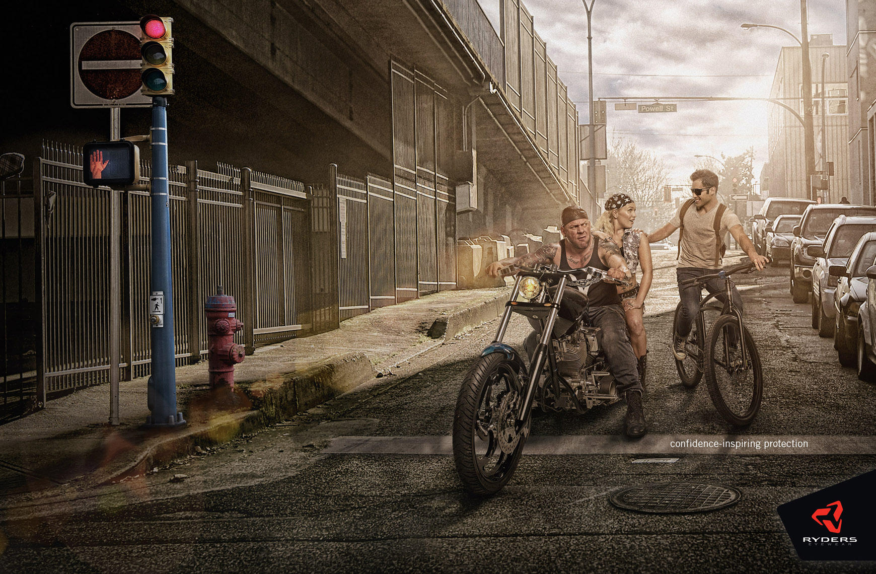 ryders eyewear motor biker with girlfriend at stop light with city cyclist